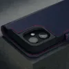 A close-up shot of a dark blue leather iPhone case with red stitching, showing the camera cutout. Produktbild-Vorschau