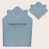 A blue hooded towel with a bear face embroidered on the hood, shown from the front and a smaller inset view. Náhled obrázku produktu