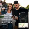 A couple walking outdoors, with the man holding a smartphone displaying the Garmin Connect app. Produktbild-Vorschau