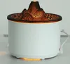 A white aroma diffuser with a volcano-shaped top emitting orange light. Náhľad obrázku produktu