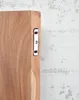 A close-up view of a wooden shelf bracket attached to a wooden shelf. Produktbild-Vorschau