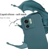 A teal phone case is shown with liquid splashes around it, highlighting its material and ease of cleaning. Produktbild-Vorschau