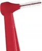 A close-up shot of a red interdental brush. Podgląd zdjęcia produktu