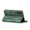 A green flip case for a smartphone is shown from a side angle, propped open. Produktbild-Vorschau