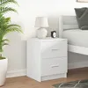 A white nightstand with two drawers is shown next to a bed. A lamp and an alarm clock are on top of the nightstand. A potted plant is to the left of the nightstand. Produktbild-Vorschau