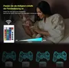 A woman holding a baby in bed, with a remote control and a brightness slider shown, and four 3D game controller lamps displayed below. Produktbild-Vorschau