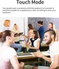 Students in a classroom setting interacting with each other, some wearing earphones. Produktbild-Vorschau