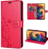 A collage of images showing a red flip phone case with a floral and butterfly design, including views of the case open with cards and cash, and the case used as a stand. Produktbild-Vorschau
