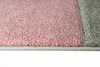 A close-up view of a carpet with pink and gray sections. Podgląd zdjęcia produktu