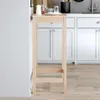 A tall, narrow wooden bar table is shown in a kitchen setting, with white cabinets visible in the background. Anteprima dell’immagine prodotto