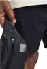A person's hand is shown reaching into a black hip bag with zippers. Anteprima dell’immagine prodotto