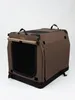 A brown fabric dog crate is shown against a white background. Produktbild-Vorschau