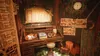 A cozy, cluttered room with a desk, a sleeping cat, and various decorative items. Anteprima dell’immagine prodotto