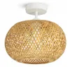 A close-up studio shot of a ceiling light with a natural bamboo shade. Podgląd zdjęcia produktu