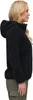 A woman is shown from the side wearing a black hooded fleece jacket and green cargo pants. Produktbild-Vorschau