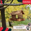 A wooden birdhouse hanging from a tree branch with two birds nearby, set against a blurred autumn background. Produktbild-Vorschau