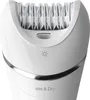 Close-up of a white epilator with a silver band and text indicating 'Wet & Dry'. Podgląd zdjęcia produktu
