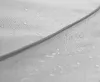 A close-up view of a gray fabric with water droplets on its surface, showing the texture of the material. Anteprima dell’immagine prodotto