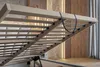 Close-up view of the slatted base of a bed frame, showing the lifting mechanism and straps. Náhled obrázku produktu