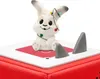 A close-up of a festive Tonies Advent Calendar with a rabbit figurine and Christmas lights. Produktbild-Vorschau