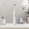 An electric toothbrush and bathroom accessories are displayed on a countertop. Produktbild-Vorschau