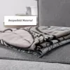 A stack of folded blankets, with a text overlay indicating it's a sample material image. Produktbild-Vorschau