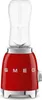 A red SMEG mini-stand mixer with a clear blending cup on top, shown against a white background. Podgląd zdjęcia produktu