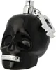 A black skull-shaped perfume bottle with a silver spray nozzle and a silver tag attached by a chain. Náhľad obrázku produktu
