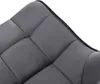 A close-up view of the tufted upholstery of a dark gray chair. Produktbild-Vorschau