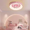 A child's bedroom with a pink unicorn-themed ceiling light and bed. Produktbild-Vorschau