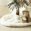A close-up view of a Christmas tree skirt and gifts. Náhľad obrázku produktu