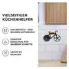 A kitchen scene with a pizza cutter shaped like a bicycle attached to a tiled wall. Produktbild-Vorschau
