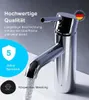 A close-up of a chrome faucet with water flowing out, set against a light gray background with marketing text and icons. Produktbild-Vorschau
