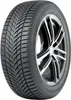 A close-up studio shot of a car tire mounted on a silver and black alloy wheel, against a white background. Podgląd zdjęcia produktu