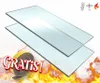 Two pieces of glass are shown with a roll of tape and flames in the background. There are also icons indicating heat resistance and thickness. Produktbild-Vorschau