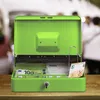 A bright green cash box is open on a wooden surface, with money and a receipt inside. People are blurred in the background. Náhled obrázku produktu