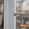 A close-up of a tension rod mounted on a window frame, with a product tag attached. Anteprima dell’immagine prodotto