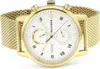 A close-up studio shot of a gold Tommy Hilfiger watch with a white face and a mesh band. Voir les images du produit
