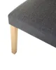 A close-up of a chair leg and seat. Náhled obrázku produktu