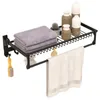 A black metal bathroom shelf with various items on it. Náhľad obrázku produktu