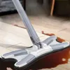 A mop cleaning up a spill on a wooden floor. Produktbild-Vorschau