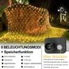 A net of warm white fairy lights draped over a large rock in a garden at night. Produktbild-Vorschau