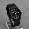 A black Casio watch is displayed on a stand against a textured gray background. Produktbild-Vorschau
