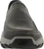 A close-up front view of a gray Skechers slip-on shoe. Anteprima dell’immagine prodotto