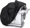 A black grill cover is draped over a silver grill. Náhľad obrázku produktu