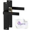 Two black door handles with a gold lock mechanism are shown against a white background. A small white cloth with a purple logo and text is in the lower right corner. Produktbild-Vorschau