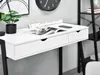 A close-up view of a white desk with black legs, featuring two drawers and a magazine on top. Voir les images du produit