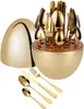 A golden cutlery set in an egg-shaped holder, with some pieces laid out in front. Produktbild-Vorschau