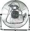 A close-up, front-facing view of a silver industrial fan with a metal grille and black motor housing, set against a plain white background. Voir les images du produit