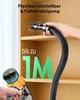 A hand is using a cordless vacuum cleaner to clean a wooden shelf. Produktbild-Vorschau
